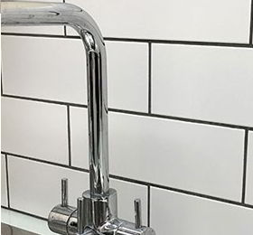 image showing bathroom tiling and fancy tap